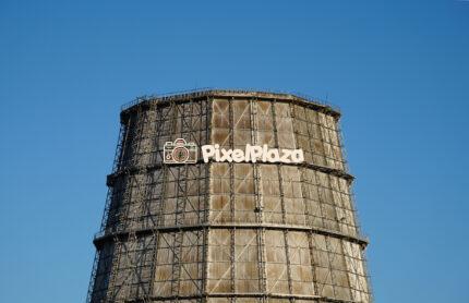 Industrial Cooling Tower Against a Clear Blue Sky